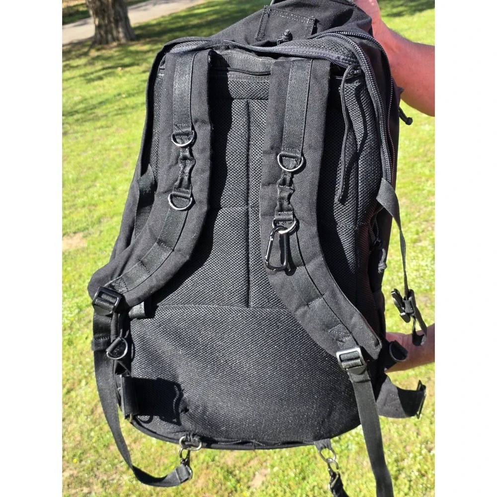 black tactical backpack is a Sandpiper of California Bugout Bag **see Pics**